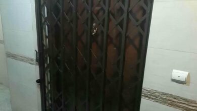 درب آکاردئونی ساختمان در کردان