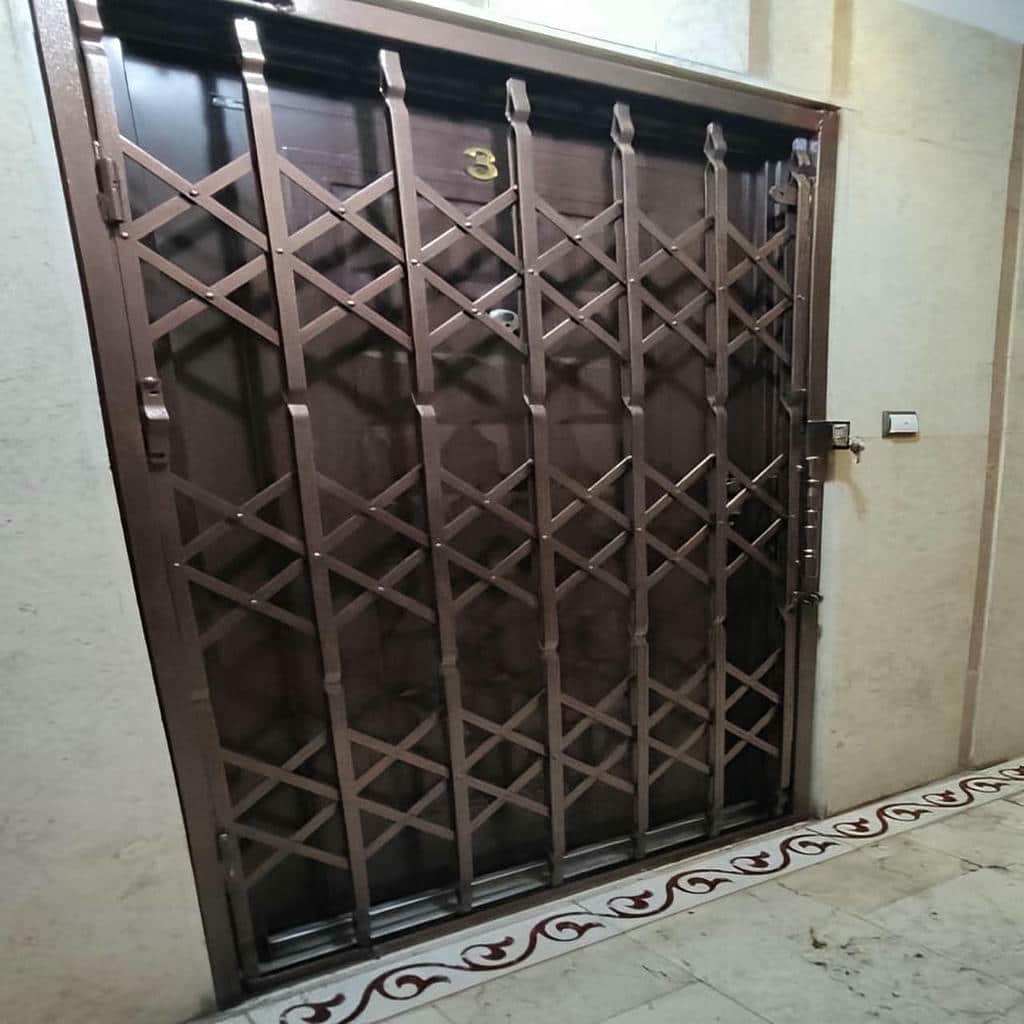 ساخت حفاظ آکاردئونی درب واحد با تسمه فولادی